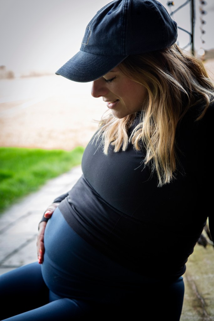 Pregnant women in baseball cap